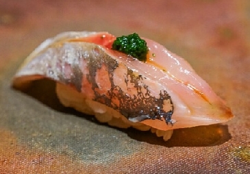 A photo of Aji nigiri
