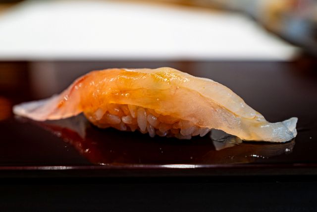 A photo of Japanese stargazer (Mishimaokoze) nigiri sushi